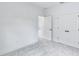 Clean bedroom featuring plush carpeting, a closet, and a doorway leading to another room at 13075 Sunrise Harvest Dr, Winter Garden, FL 34787