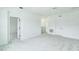 Bright bedroom featuring plush gray carpet, and crisp white walls creating a serene and modern space at 13075 Sunrise Harvest Dr, Winter Garden, FL 34787