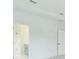 Bright hallway with a view of the primary bathroom at 13075 Sunrise Harvest Dr, Winter Garden, FL 34787