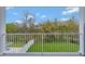 The balcony offers views of the trees and manicured landscaping at 13075 Sunrise Harvest Dr, Winter Garden, FL 34787