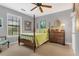 Traditional bedroom showcasing a four-poster bed with a green patterned comforter, complemented by neutral walls and carpet at 1315 E 24Th St, Sanford, FL 32771
