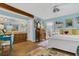 Airy bedroom featuring a comfortable bed, hardwood floors, ensuite bathroom, and bright accents at 1315 E 24Th St, Sanford, FL 32771