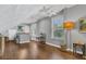 Bright bonus room with hardwood floors, two windows, ceiling fan, and neutral color palette at 1315 E 24Th St, Sanford, FL 32771