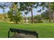 Scenic view of a park with a pond, fountain, and lush green lawn, creating a peaceful outdoor space at 1315 E 24Th St, Sanford, FL 32771