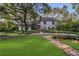 Beautifully landscaped home with a lush green lawn and a stone walkway leading to the front door at 1315 E 24Th St, Sanford, FL 32771