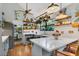 Bright kitchen featuring custom cabinets, quartz countertops, stylish decor, and stainless steel appliances at 1315 E 24Th St, Sanford, FL 32771