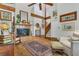 Comfortable living room with fireplace, beamed ceiling, hardwood floors, and a neutral color palette at 1315 E 24Th St, Sanford, FL 32771