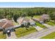Aerial view of a single-Gathering home with a beautiful treeline in the distance at 1321 Dunbarton Ct, Kissimmee, FL 34758