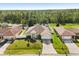 Aerial view of a single-Gathering home showing the front yard, driveway, and landscaping at 1321 Dunbarton Ct, Kissimmee, FL 34758