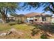 Home exterior showing a backyard with grass and patio at 1321 Dunbarton Ct, Kissimmee, FL 34758