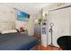 Well-lit bedroom featuring a mounted TV, laminate floors and plenty of storage at 1321 Dunbarton Ct, Kissimmee, FL 34758
