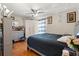 Comfortable bedroom featuring a ceiling fan and laminate floors and neutral decor at 1321 Dunbarton Ct, Kissimmee, FL 34758