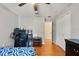 Bright bedroom with a closet, light walls, wood-look flooring, and ceiling fan at 1321 Dunbarton Ct, Kissimmee, FL 34758