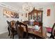 Elegant dining room with a chandelier, a formal dining set, and stylish decor at 1321 Dunbarton Ct, Kissimmee, FL 34758