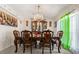 Elegant dining room with chandelier and formal dining set, perfect for gatherings at 1321 Dunbarton Ct, Kissimmee, FL 34758