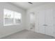 Bright bedroom features a large window and ample closet space, creating a comfortable and functional area at 141 S. Park Ave, Winter Garden, FL 34787
