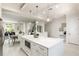 Spacious kitchen with a large island, a built-in microwave, and modern white cabinetry at 141 S. Park Ave, Winter Garden, FL 34787