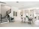 Inviting living area with an open floor plan, dining space, and a staircase leading to the upper level at 141 S. Park Ave, Winter Garden, FL 34787