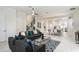 Open concept living room flowing into the dining and kitchen areas with comfortable seating and stylish decor at 141 S. Park Ave, Winter Garden, FL 34787