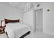This bedroom features white walls, tile floor, modern fixtures, closet, and a platform bed at 150 E Robinson St # 2111, Orlando, FL 32801