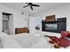 Bright bedroom with a flat-screen TV, ceiling fan, and seating with comfortable red chair at 150 E Robinson St # 2111, Orlando, FL 32801