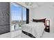 Bedroom featuring a large window with a cityscape view and modern chandelier at 150 E Robinson St # 2111, Orlando, FL 32801