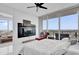 Bright bedroom boasts large windows and access to a balcony with scenic views at 150 E Robinson St # 2111, Orlando, FL 32801