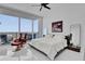 Bright bedroom featuring tile floors, large windows, and a comfortable seating area at 150 E Robinson St # 2111, Orlando, FL 32801