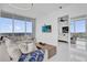Inviting living room featuring a large sofa, access to the bedroom, and great city views at 150 E Robinson St # 2111, Orlando, FL 32801