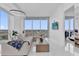 A large and open living room and lounge area with walls of windows at 150 E Robinson St # 2111, Orlando, FL 32801