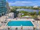 Inviting rooftop pool area featuring comfortable lounge chairs and panoramic city views, perfect for relaxation at 150 E Robinson St # 2111, Orlando, FL 32801