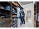 Organized walk-in closet with custom shelving and storage solutions. Adjacent to en-suite bathroom at 150 E Robinson St # 2111, Orlando, FL 32801