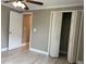 Bedroom featuring light gray walls, ceiling fan, and double closet at 1516 Culverhouse Dr, Daytona Beach, FL 32117