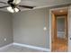 Bedroom featuring light gray walls, ceiling fan, and view into hallway at 1516 Culverhouse Dr, Daytona Beach, FL 32117