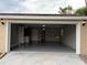 Garage interior featuring large open space with epoxy flooring and utility sink at 1516 Culverhouse Dr, Daytona Beach, FL 32117
