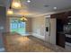 Open-concept kitchen and dining area featuring stainless steel appliances and sliding glass doors to the backyard at 1516 Culverhouse Dr, Daytona Beach, FL 32117