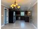 Modern kitchen with stainless steel appliances, granite counters and dark wood cabinets at 1516 Culverhouse Dr, Daytona Beach, FL 32117