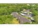 Aerial view of the community with lush foliage surrounding well maintained condos and carport parking at 1525 Farrindon Cir, Lake Mary, FL 32746