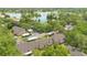 Stunning aerial view showcasing lakefront community, mature trees and beautiful landscaping at 1525 Farrindon Cir, Lake Mary, FL 32746