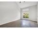Bright bedroom featuring vaulted ceilings, wood flooring, and a window that brings in plenty of natural light at 1525 Farrindon Cir, Lake Mary, FL 32746