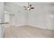 Spacious floor plan featuring vaulted ceiling, light wood-look flooring, and neutral paint at 1525 Farrindon Cir, Lake Mary, FL 32746