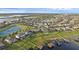 Aerial view of waterfront homes with private docks and pools at 16086 Johns Lake Overlook Dr, Winter Garden, FL 34787