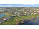 Aerial view of a waterfront neighborhood with various bodies of water at 16086 Johns Lake Overlook Dr, Winter Garden, FL 34787