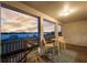 Relax on this balcony with stunning sunset lake views and comfortable seating at 16086 Johns Lake Overlook Dr, Winter Garden, FL 34787