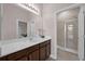 Bathroom vanity features a white countertop and dark wood cabinets at 16086 Johns Lake Overlook Dr, Winter Garden, FL 34787
