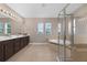 Spacious bathroom features a large soaking tub, walk-in shower, and double vanity at 16086 Johns Lake Overlook Dr, Winter Garden, FL 34787