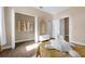 Bright bedroom featuring a walk-in closet, hardwood floors and a decorative unicorn at 16086 Johns Lake Overlook Dr, Winter Garden, FL 34787