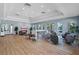 Spacious community room features comfortable seating, a TV, and stylish decor, perfect for gatherings at 16086 Johns Lake Overlook Dr, Winter Garden, FL 34787