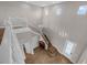 Grand two-story foyer with chandelier lighting and wood staircase at 16086 Johns Lake Overlook Dr, Winter Garden, FL 34787