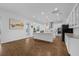 Well-lit kitchen with large island, modern stainless appliances, and white cabinetry at 16086 Johns Lake Overlook Dr, Winter Garden, FL 34787